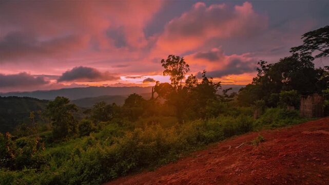 sunset over the mountains at Ruma Tazingdong peak range in Bandarban district in Bangladesh.  I filmed at golder hour time- lapse video.  