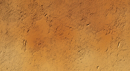 Texture of a brown wall, rough surface with uneven color and small holes