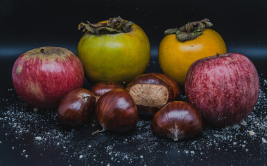 A composition of typically autumnal fruits such as chestnuts, persimmons or the Campanian Annurca apple, enhancing their beauty and detail.