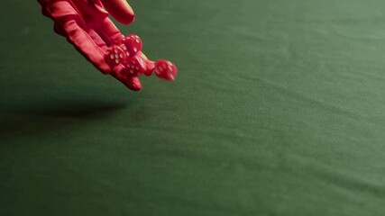 Close up of hand rolling and dropping red dice on green suede 4K Ultra HD video symbolizing luck, chance, risk and casino gaming concept with vibrant color contrast and detailed gambling background - Powered by Adobe