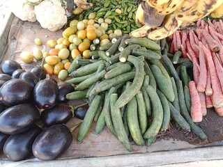 Different vegetables and fruits pile show for sale in the market 