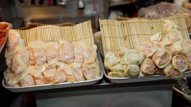 Mandu dumplings on display for sale at a Korean street food stall