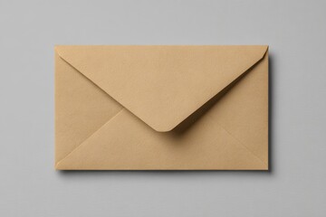 Elegant brown envelope resting on light gray background featuring a pointed flap and neat folds, crafted from matte material for a simple yet sophisticated look, free from any text or images