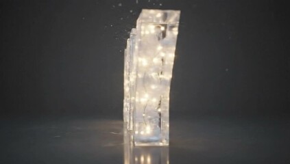 Rotating glowing translucent letter J filled with sparkling lights, symbolizing joy, elegance, and festive holiday ambiance in a modern style.
- Powered by Adobe