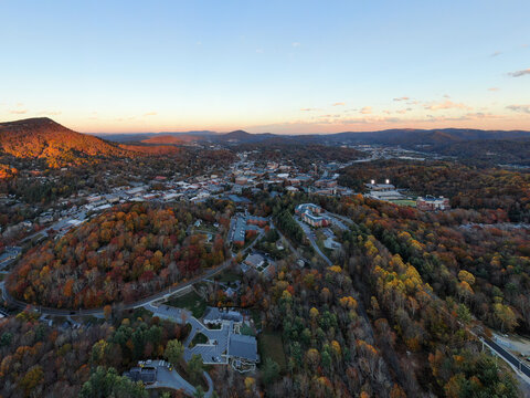 Golden Hour Sunset Drone View of Boone North Carolina Nestled in Vibrant Fall Foliage.