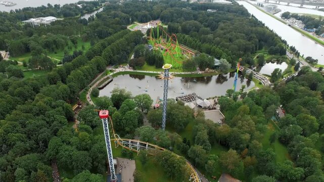 Aerial amusement park scene, flying above catapult, Divo island park, summer day