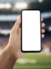 Football app mockup with ground background, smartphone screen showing soccer interface, digital sports technology and online game concept, green stadium field for football match, athletic lifestyle ph