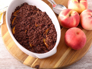 Homemade Chocolate peach crumble dessert in a tin