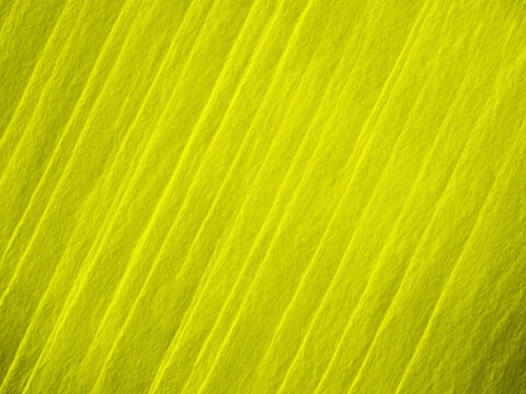 Vibrant Yellow Textured Background with Diagonal Stripes - Powered by Adobe