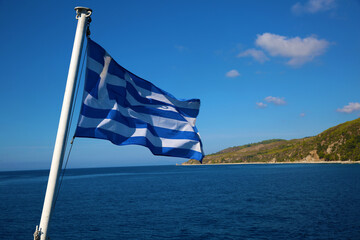 The Greek flag against the backdrop of Greece