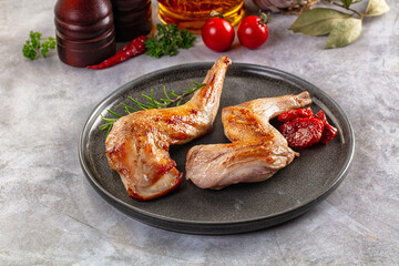 Roasted rabbit leg served rosemary