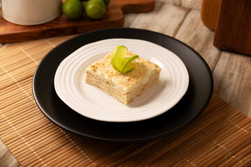 Carlota de Limon, a cold, no-bake dessert made with layers of Maria cookies and a creamy mixture of lemon and condensed milk, an easy homemade recipe very popular in Mexico.
