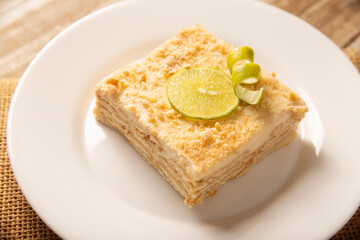 Carlota de Limon, a cold, no-bake dessert made with layers of Maria cookies and a creamy mixture of lemon and condensed milk, an easy homemade recipe very popular in Mexico.