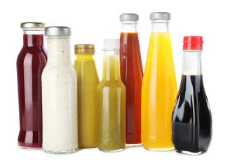 Bottles with different tasty sauces isolated on white