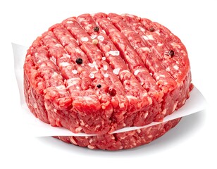 Close-up view of a raw, seasoned beef patty, ready for cooking