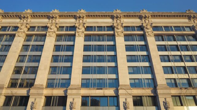 Refined stonework and expansive windows create a timeless facade that embodies sophistication and history.

