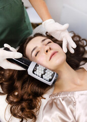 young woman in beauty salon doing skin care procedure