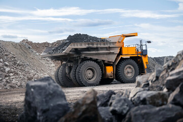 Open pit mine industry banner , big yellow mining truck for copper ore