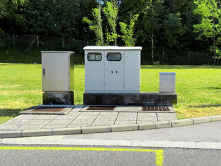 Roadside electrical utility cabinets in park