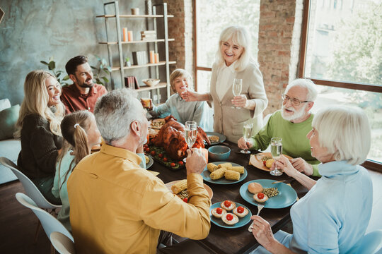 Funny warm family feast for thanksgiving a lively table full of laughter love and shared memories with extended family friends