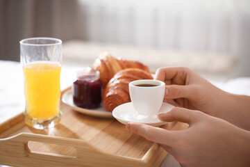 Man having breakfast in bed, closeup. Hotel room service