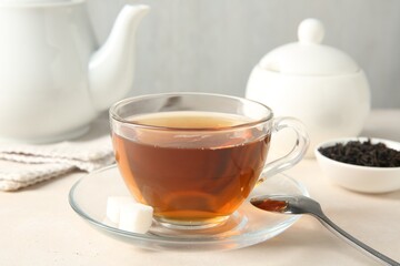 Delicious tea and brew on white table, closeup