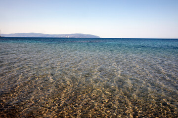 Obraz premium Kefalonia- Greece - August 15, 2025: Mounda beach needs Skala, Kefalonia, Greece.