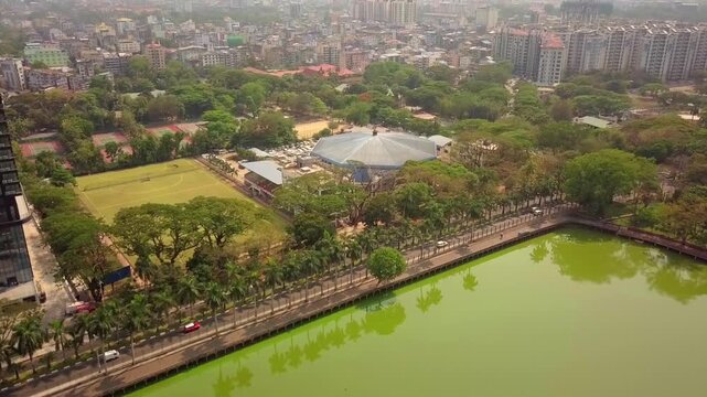  Futuristic aerial view panorama of developing Yangon city , Aerial view of Sule pagoda in downtown, Yangon, Myanmar. Sule Pagoda located in the heart of Yangon, Karaweik royal barge, Kandawgyi Lake, 
