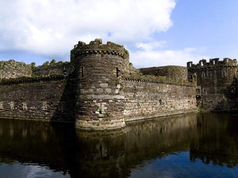 Beaumaris Castle Anglesey, North Wales. Dramatic historic ruins. UNESCO monument. Beautiful medieval castle with moat. Intact fortress walls.