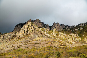 View of the mountains of the Valley of Ghosts with mountain hills, boulders on a clear sunny day. Landscape, sights of Russia, sea, mountains.