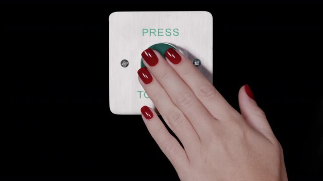 hand pressing an industrial press to exit button