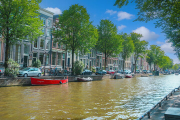 August 20, 2025, Amsterdam, Netherlands, view of the houses on the Oudezijds Voorburgwal river.