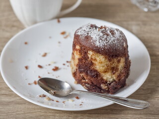 Marble Cake on plate with Spoon - Dessert dusted with powdered sugar