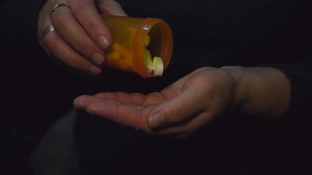 woman taking pills. slow motion