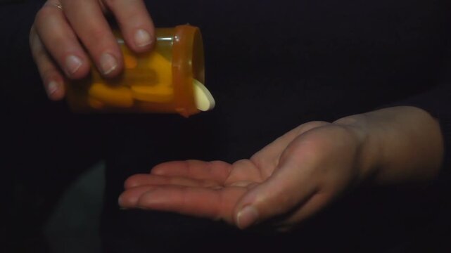 woman taking pills. slow motion
