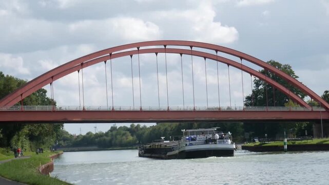 a barge on a water canal near the city of herstel