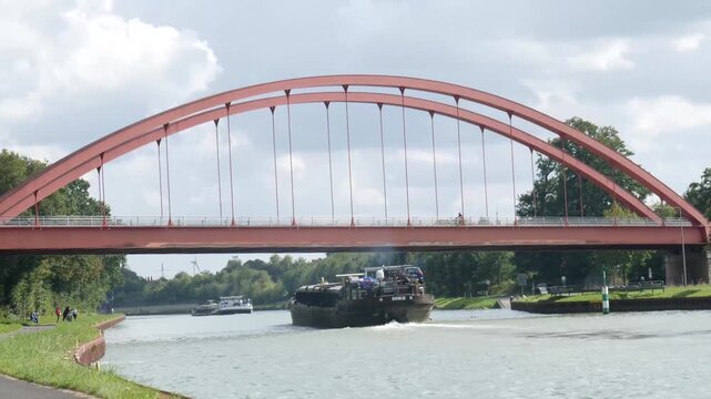 a barge on a water canal near the city of herstel
