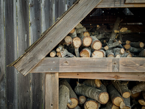 stack of firewood in a little wood cabin