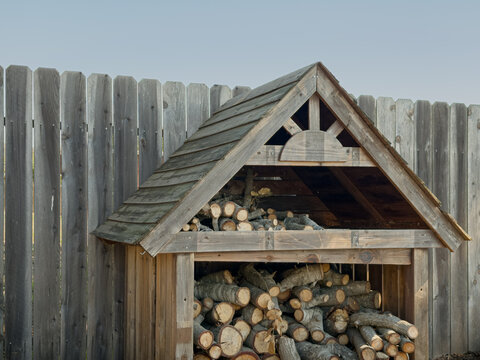 stack of firewood in a little wood cabin