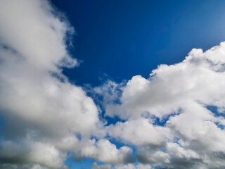 Bright blue sky with white clouds. Nature background.