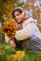Children enjoy autumn in the park together