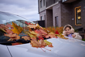 Kids enjoying autumn leaves in the park