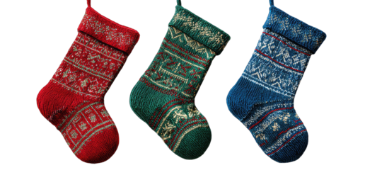 Three Christmas stockings, red, green, and blue, patterned with festive designs