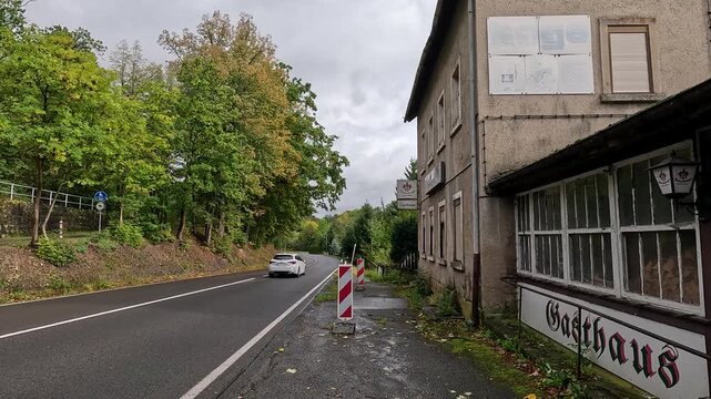 Dresden Germany rural road Gasthaus traffic. Driving point of view. Industrial center of East Germany, now unified German, European Union (EU) and NATO. Total destruction in WW II and now rebuilt.