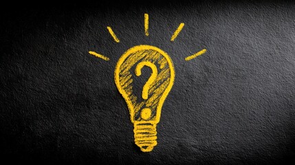 A light bulb with a question mark inside drawn with chalk on a blackboard