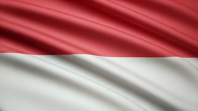 Dynamic motion of the monaco flag waving gently in the breeze creating a patriotic and nationalistic mood with red and white