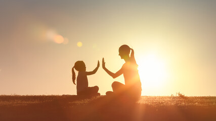 Parent child relationship concept. Mother giving daughter high five. Family support, childhood,...