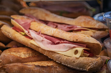 Freshly made sandwiches with ham and cheese on display at an artisanal bakery in the old town or Vieille Ville, Nice, France
