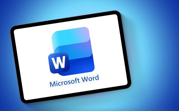 Microsoft Word Logo is displayed on a modern tablet computer laying on a blue gradient underground, new 2025 logo, word processor, editing, thesaurus, dictionary