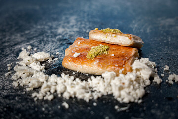 Traditional Palestinian Kulaj Sweet with Cheese  or Walnut Filling and Pistachio Garnish 